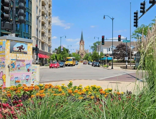 Sunny view of the downtown Skokie intersection at Oakton Street, a vibrant local community served by Elevate Plumbing's expert local plumbers.