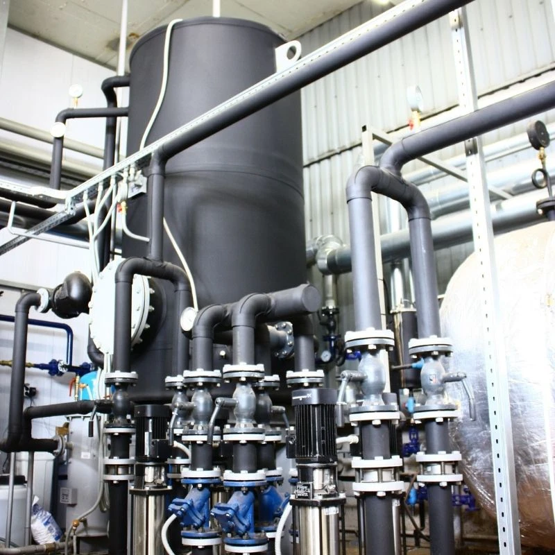 Heavy-duty commercial water heating system and industrial pumping station being serviced by expert plumbing contractors in a Skokie commercial facility.