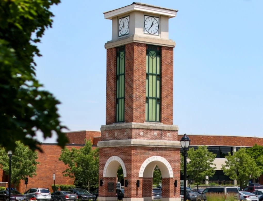 The iconic brick clock tower monument with archways in Elk Grove Village.
